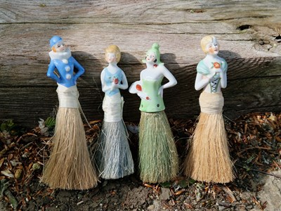 Lot 77 - Four porcelain figures, each with her own...