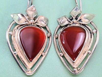 Lot 93 - Silver drop earrings in an openwork design...