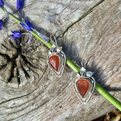 Lot 93 - Silver drop earrings in an openwork design...