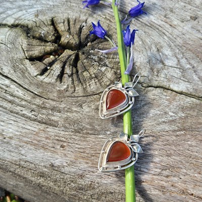 Lot 93 - Silver drop earrings in an openwork design...