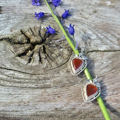 Lot 93 - Silver drop earrings in an openwork design...