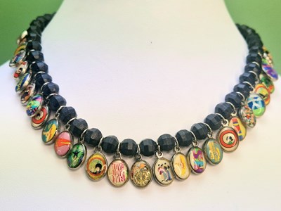 Lot 113 - A vintage Beatles-themed charm necklace, full...