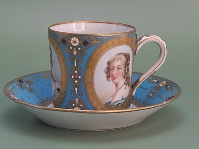 Lot 1029 - A Sevres turquoise blue ground jewelled coffee...