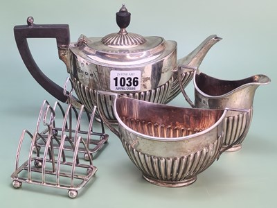 Lot 1036 - A silver three piece bachelor's tea set by...