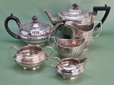 Lot 1038 - A silver three piece tea set by William Naul,...