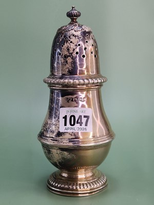 Lot 1047 - A silver baluster caster, London 1932, 222g