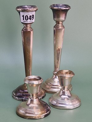 Lot 1049 - A pair of Birmingham silver candlesticks H...