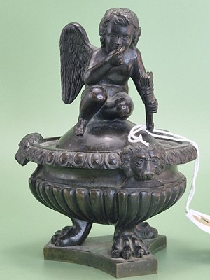 Lot 1058 - A 19th century bronze inkwell, the cover with...