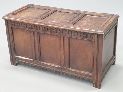 Lot 1068 - An early 18th century oak coffer with a chip...