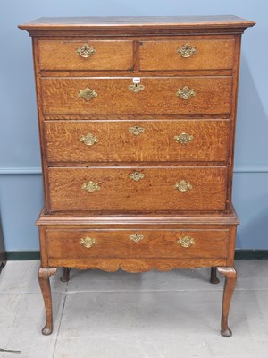 Lot 1069 - An 18th century oak chest on stand, the top...