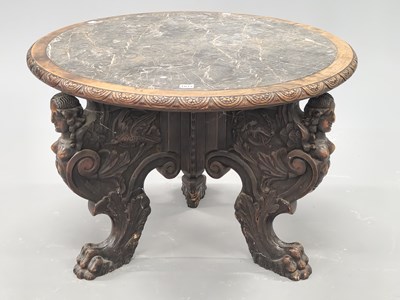 Lot 1077 - A grey marble topped oak coffee table, the...