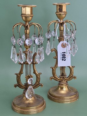 Lot 1082 - A pair of ormolu lustre candlesticks, the lyre...