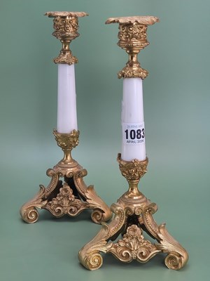 Lot 1083 - A pair of white marble and ormolu candlesticks,...