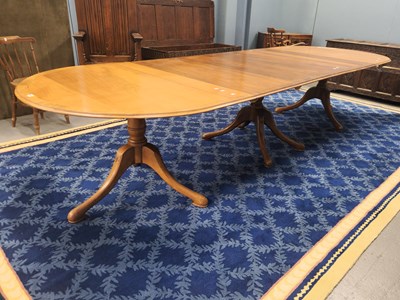 Lot 1084 - A cross banded mahogany three column D-end...