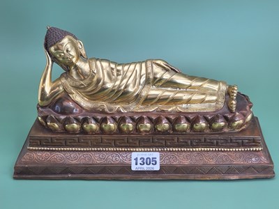 Lot 1305 - A parcel gilt figure of the Buddha reclining...