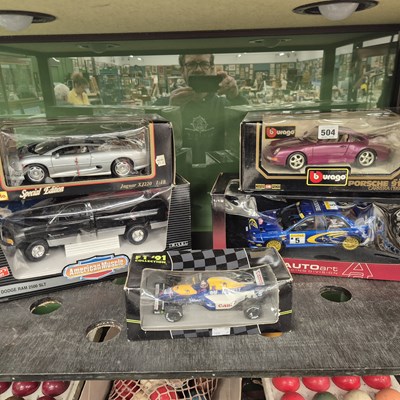 Lot 504 - Five boxed scale model sports cars by Maisto,...