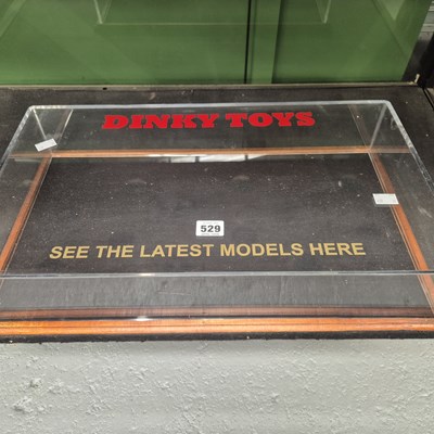 Lot 529 - A Dinky toy table top display case