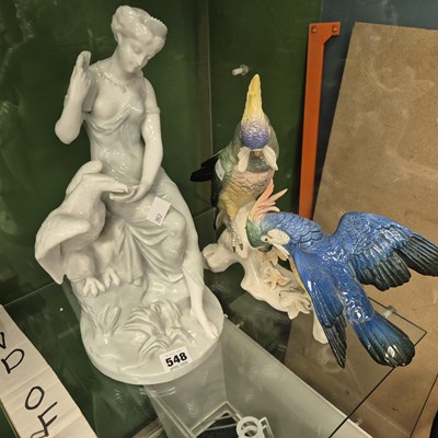 Lot 548 - A celadon glazed figure of Juno feeding an...