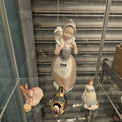 Lot 556 - A Nao shepherdess, a Derby bird, a Doulton...