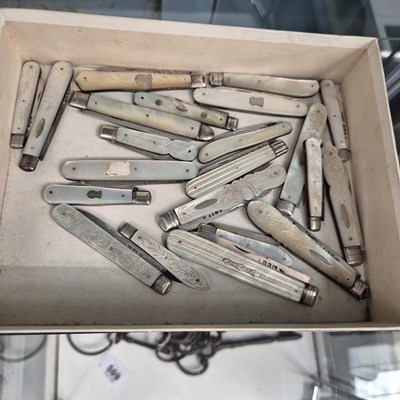 Lot 568 - A collection of twenty two mother of pearl...
