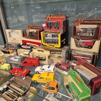 Lot 593 - Boxed and loose die cast cars, vans and buses...