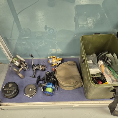 Lot 606 - Four fly fishing reels, another reel, and a...