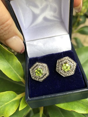 Lot 1106 - A pair of silver gilt hexagonal stud earrings...