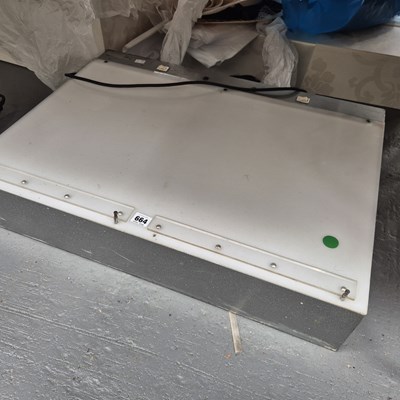 Lot 664 - A binocular microscope with electric light...