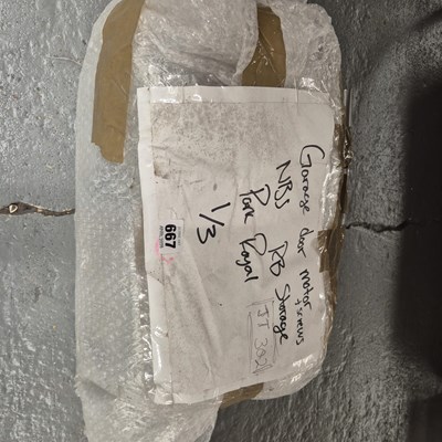 Lot 667 - A garage door motor together with fixings