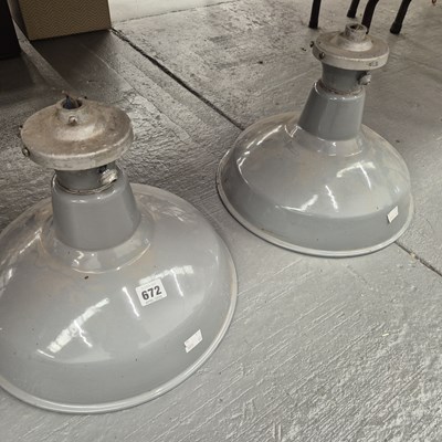 Lot 672 - A pair of grey enamel ceiling light shades