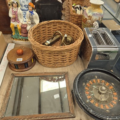 Lot 677 - A roulette wheel, a rack of coloured counters,...