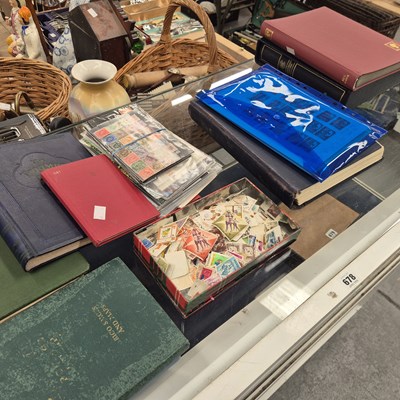 Lot 678 - Eight stamp albums, loose stamps together with...