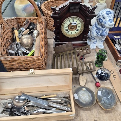 Lot 681 - A basket of cutlery, a mantle clock, a dog...