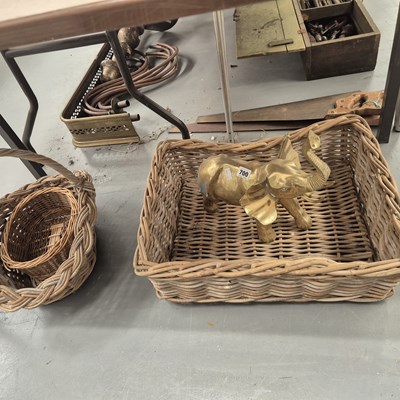 Lot 700 - A brass elephant together with three baskets