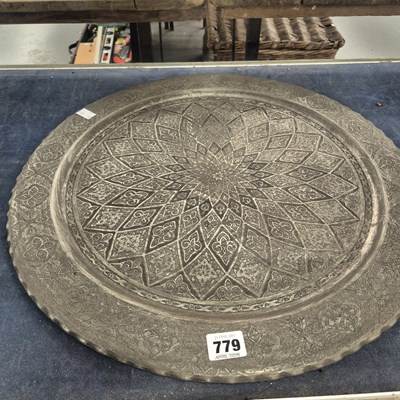 Lot 779 - An Islamic zinc dish. D 50cms