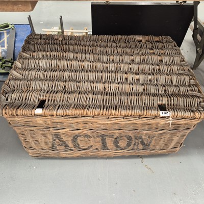 Lot 782 - A linen basket containing a floral quilt