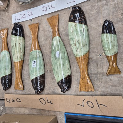 Lot 794 - Six pottery wall mounting models of fish