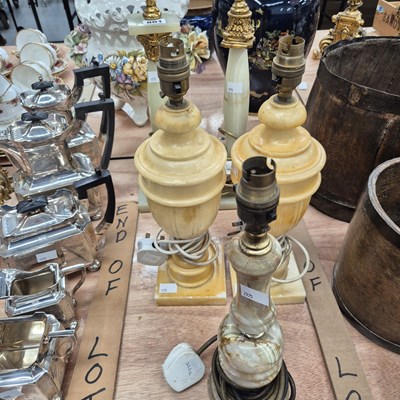 Lot 801 - A pair of ochre marble table lamps together...