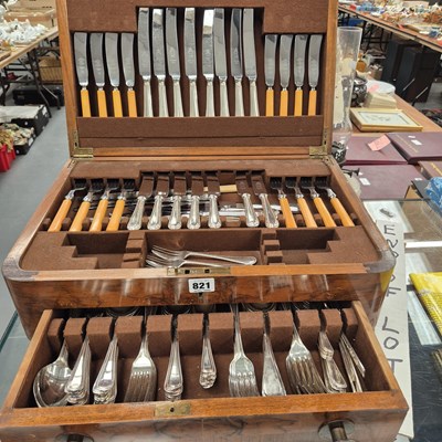 Lot 821 - A walnut canteen of electroplate bead pattern...