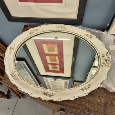 Lot 18 - An oval wall mirror with painted frame