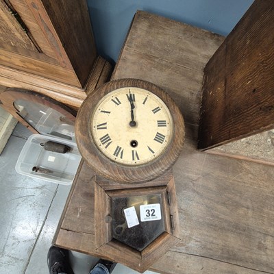 Lot 32 - A small wall clock