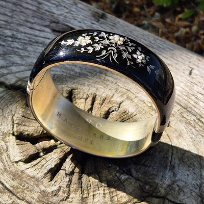 Lot 123 - A continental silver bangle, dated 1884....