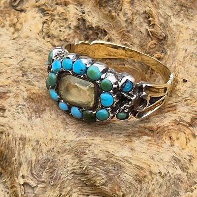 Lot 124 - An antique turquoise set ring, size M Set with...