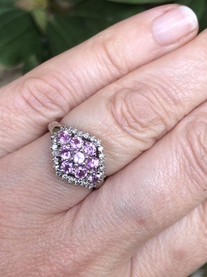 Lot 1134 - A hallmarked 9ct white gold pink sapphire and...