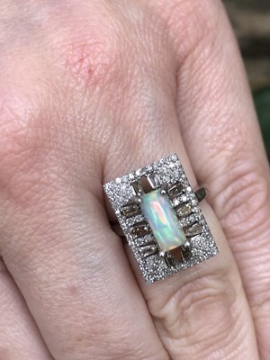 Lot 1135 - Silver oblong dress ring set with a...