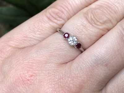 Lot 1138 - 18ct white gold three-stone ring set with a...