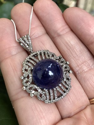 Lot 1150 - A silver pendant set with a large round...