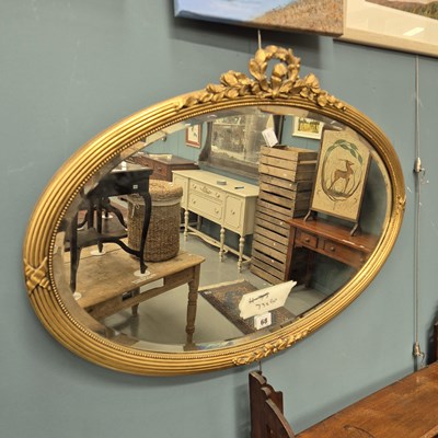 Lot 68 - An oval gilt framed mirror 73 × 50cm