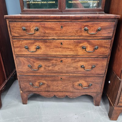 Lot 95 - A late Georgian mahogany chest of four long...