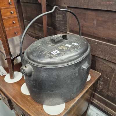 Lot 104 - An iron cooking pot, as well as a fire screen...